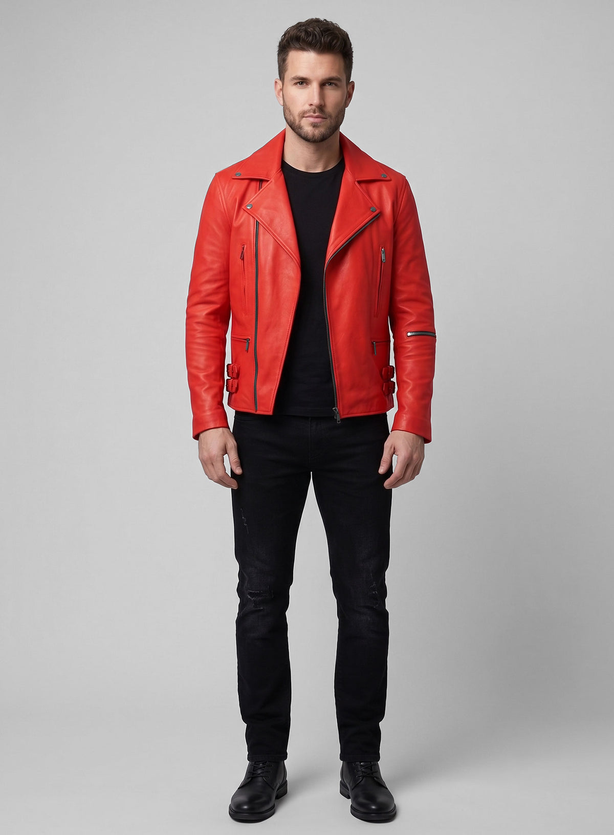 Full-length view of a man wearing a red leather biker jacket with black jeans and boots
