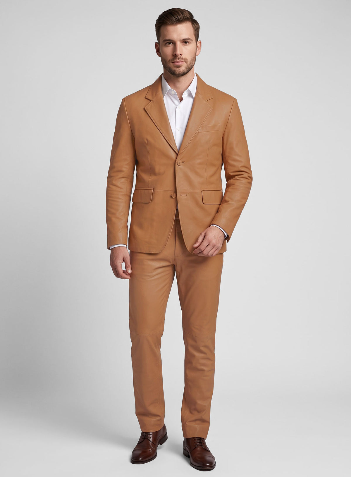 Man wearing a tan lambskin leather suit with notch lapel blazer and trousers