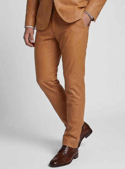 Man wearing tan brown leather suit trousers with brown lace-up shoes