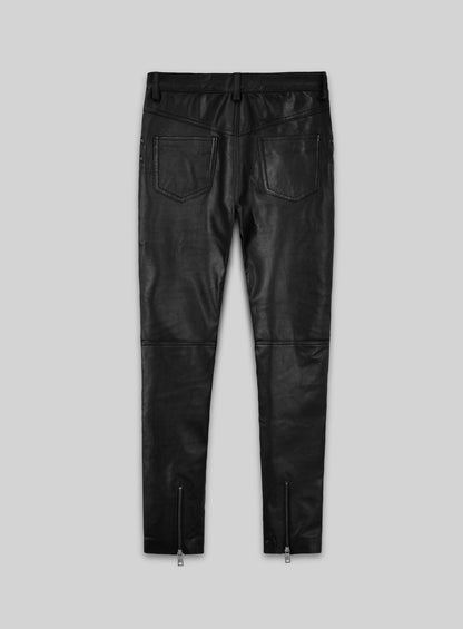 Back view of black leather biker pants with back pockets and ankle zips