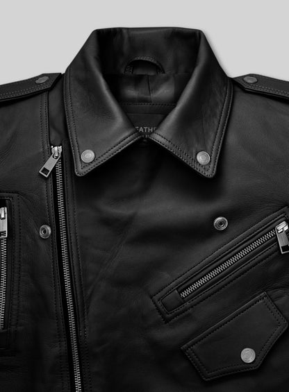 Close-up of black leather biker jacket collar with snaps, zip pockets and epaulettes