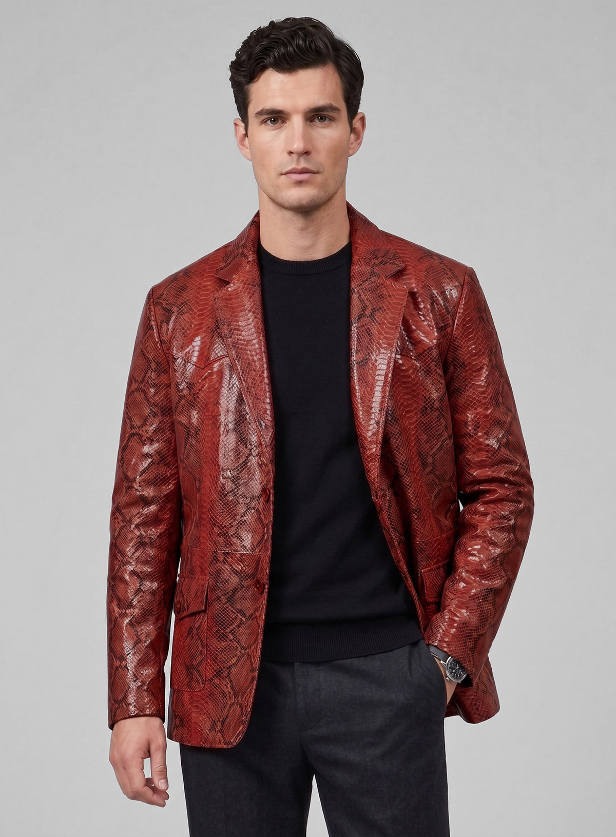 Man wearing a red python-print western leather blazer with notch lapel and flap pockets