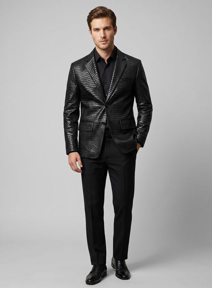 Full-length view of a man in a black croc-embossed leather blazer, black shirt and trousers