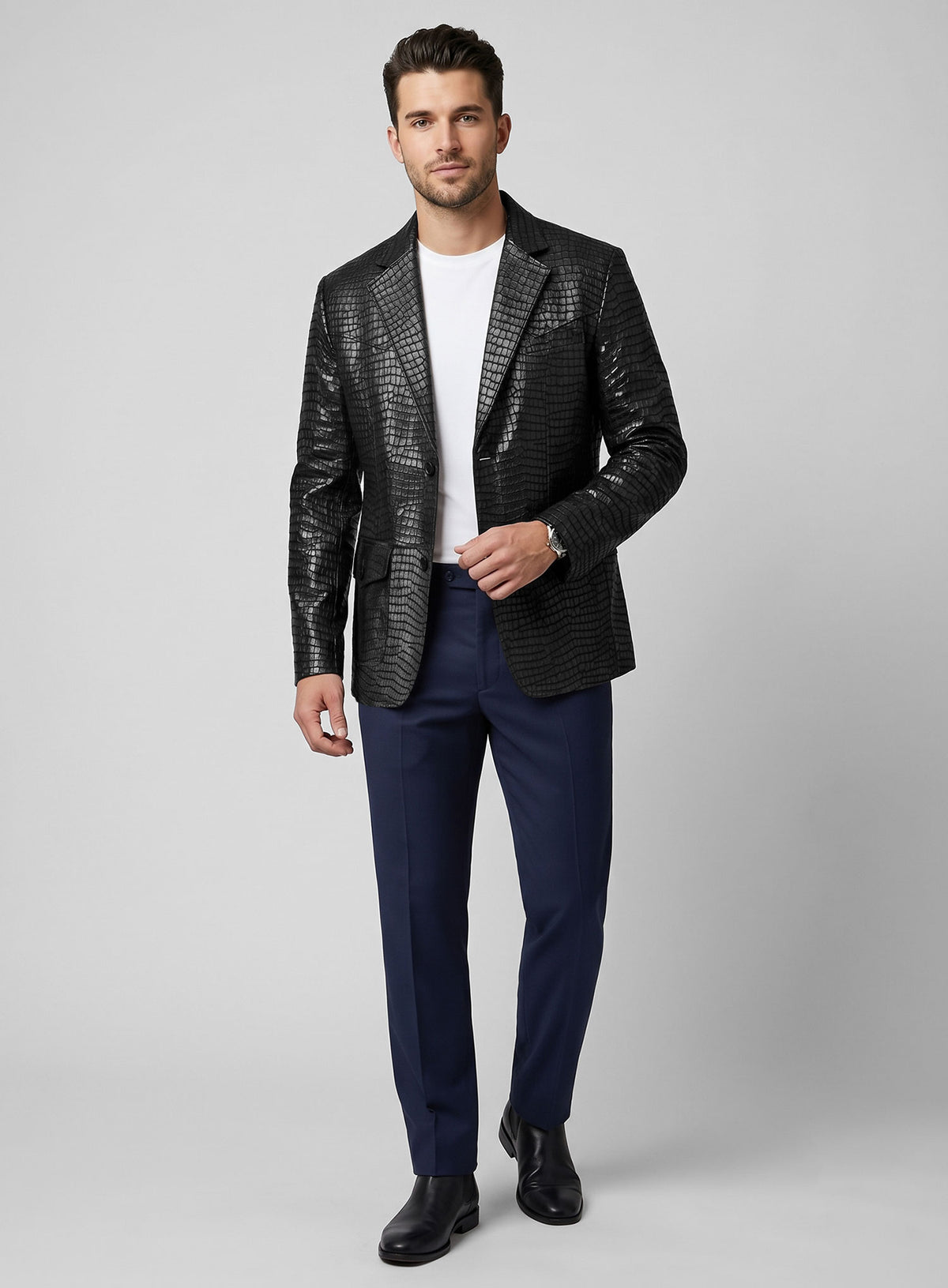 Man wearing a black croc leather western blazer with navy trousers, full length view
