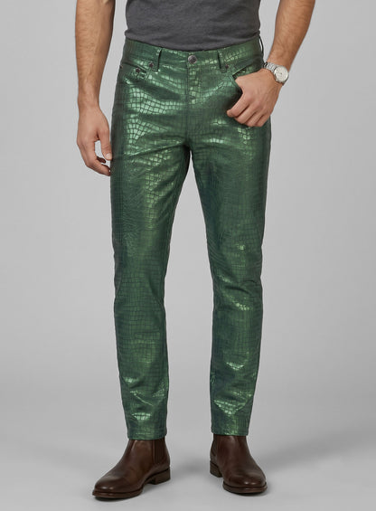 Man wearing metallic green croc-embossed leather jeans-style pants, front close-up