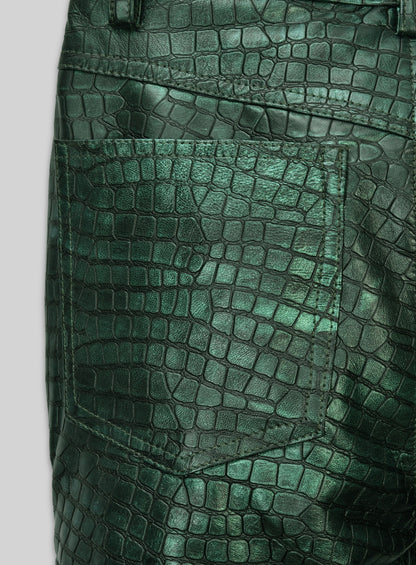 Close-up of back pocket on metallic green croc-embossed leather jeans-style pants