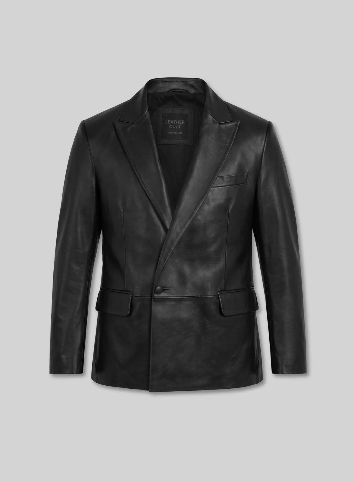 Front view of a black double-breasted leather blazer with peak lapel