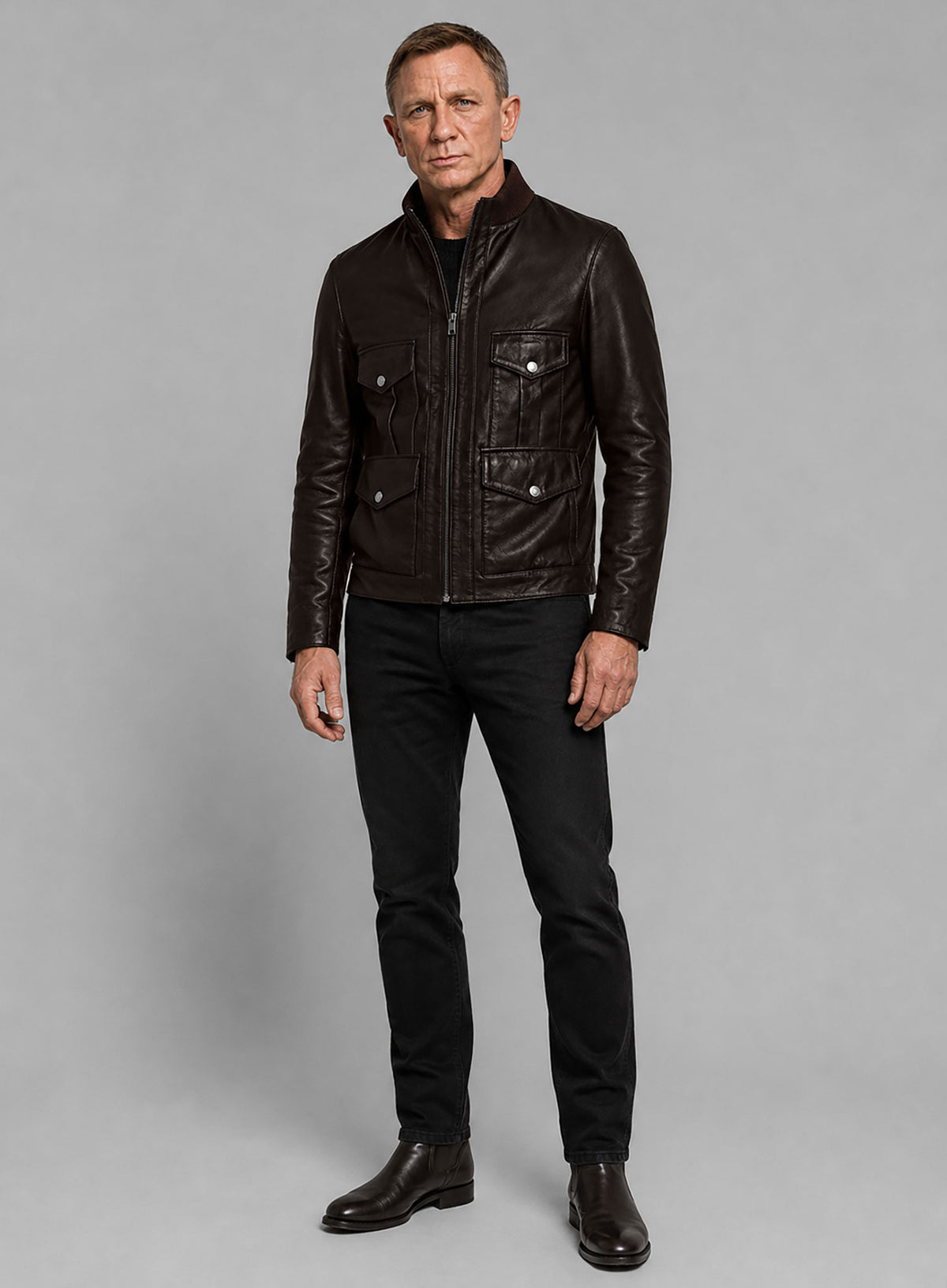 Full-length view of a man wearing a dark brown leather jacket with four flap pockets and a ribbed collar