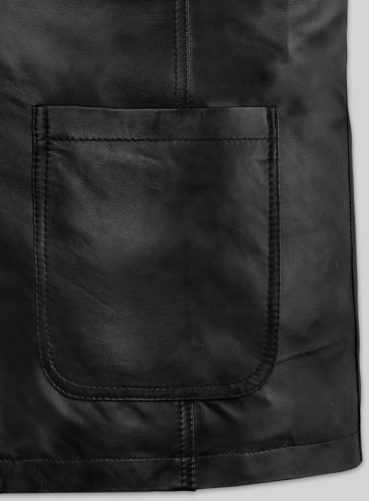 Close-up of a patch pocket and stitching on a black leather blazer