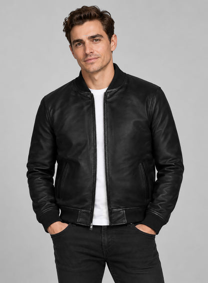 Man wearing a black leather bomber jacket with ribbed collar and cuffs, front view