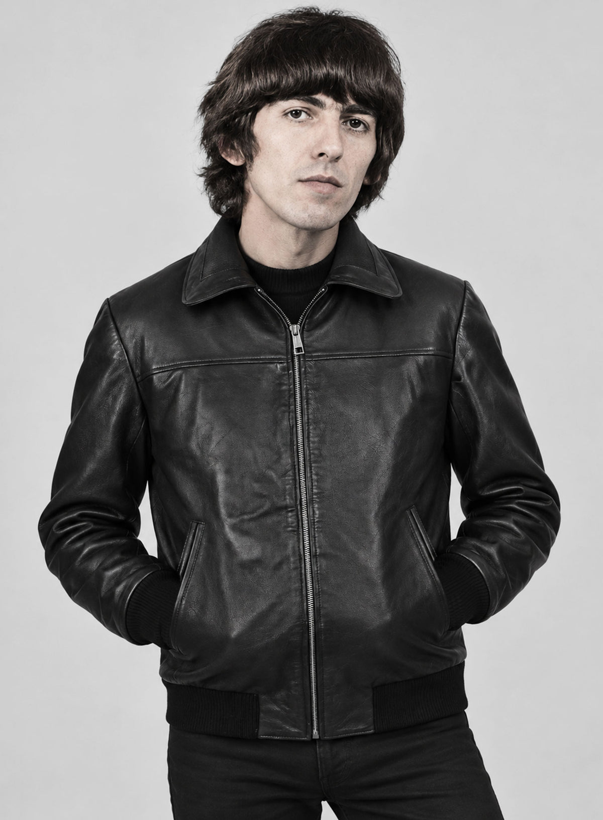 Man wearing a black leather bomber jacket with collar and zip front, George Harrison inspired