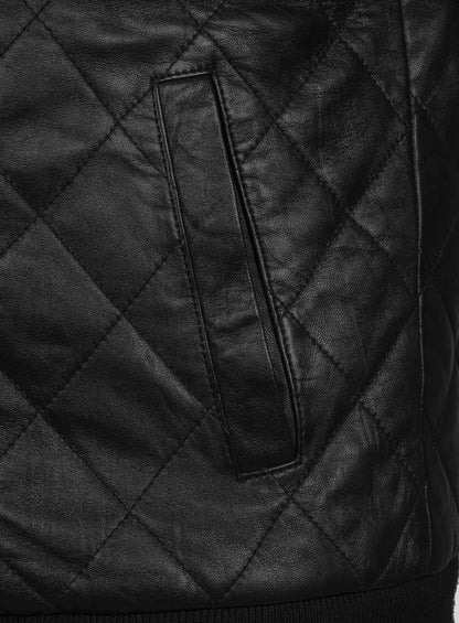 Close-up of welt pocket on black diamond-quilted leather jacket