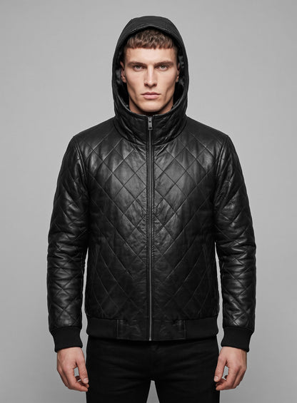 Man wearing a black quilted leather bomber jacket with hood up