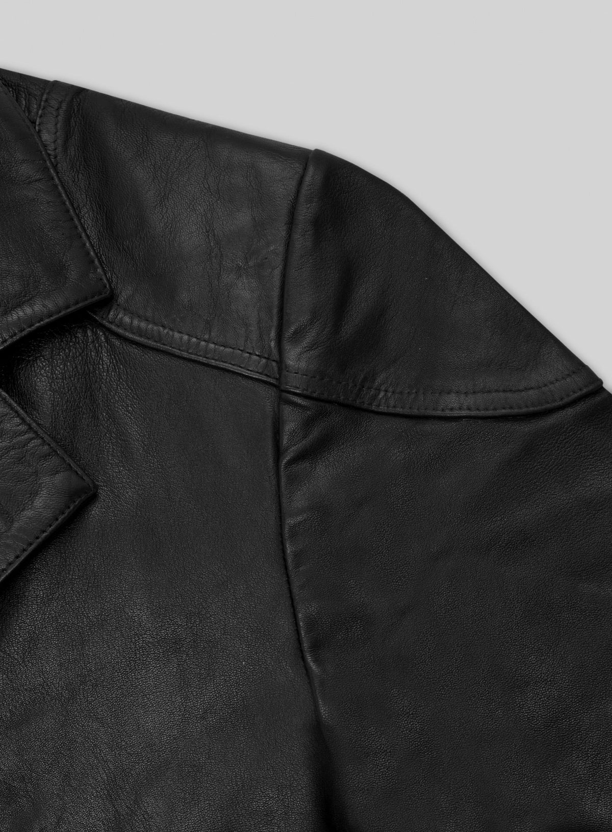 Detail of black leather long coat collar and shoulder stitching