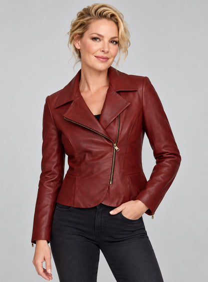Woman wearing a fitted red leather biker jacket with notch lapel and gold asymmetric zip