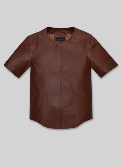 Front view of a brown leather t-shirt with center seam and curved hem
