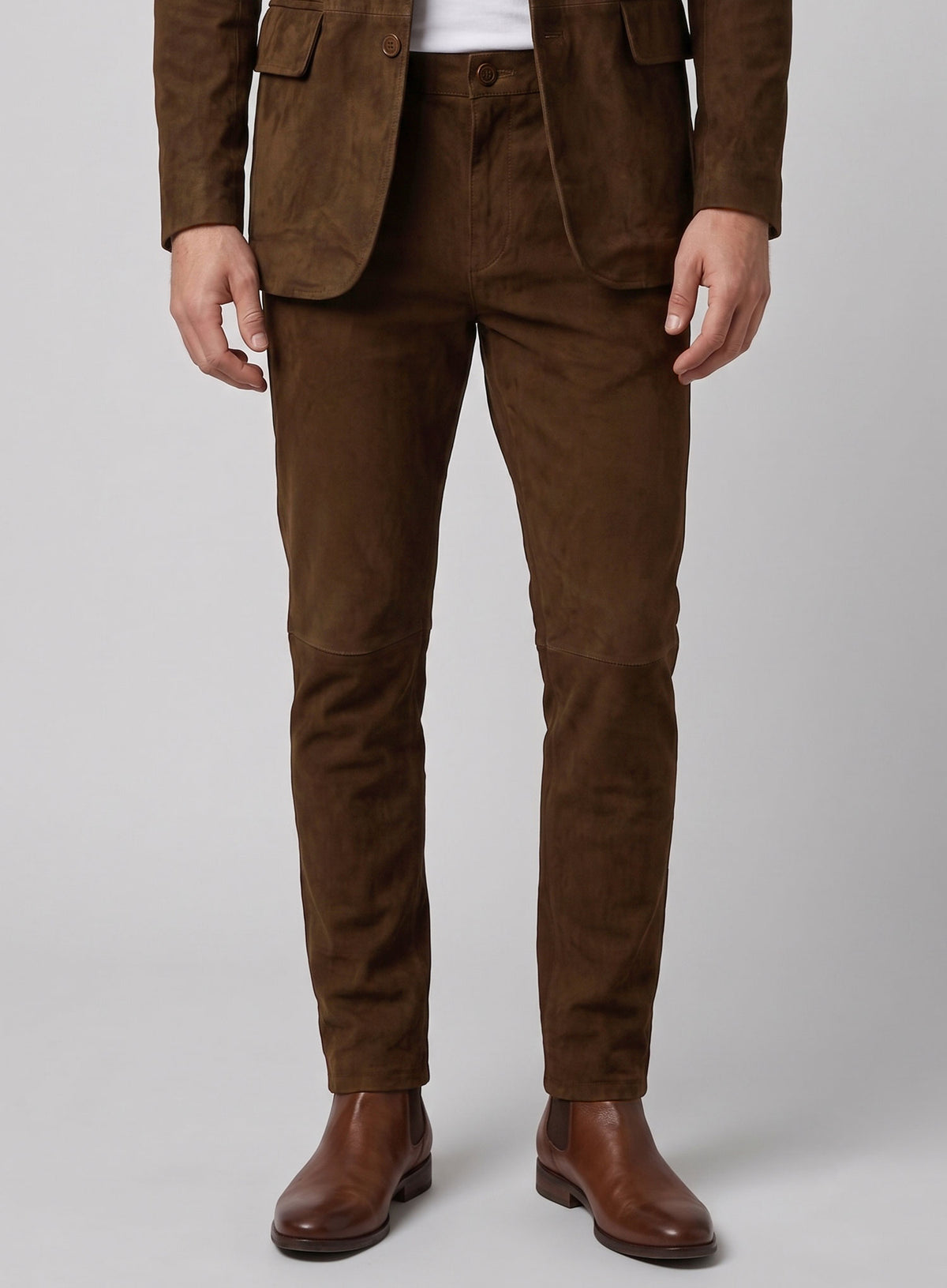 Man wearing mid brown suede leather trousers with a matching blazer and tan boots