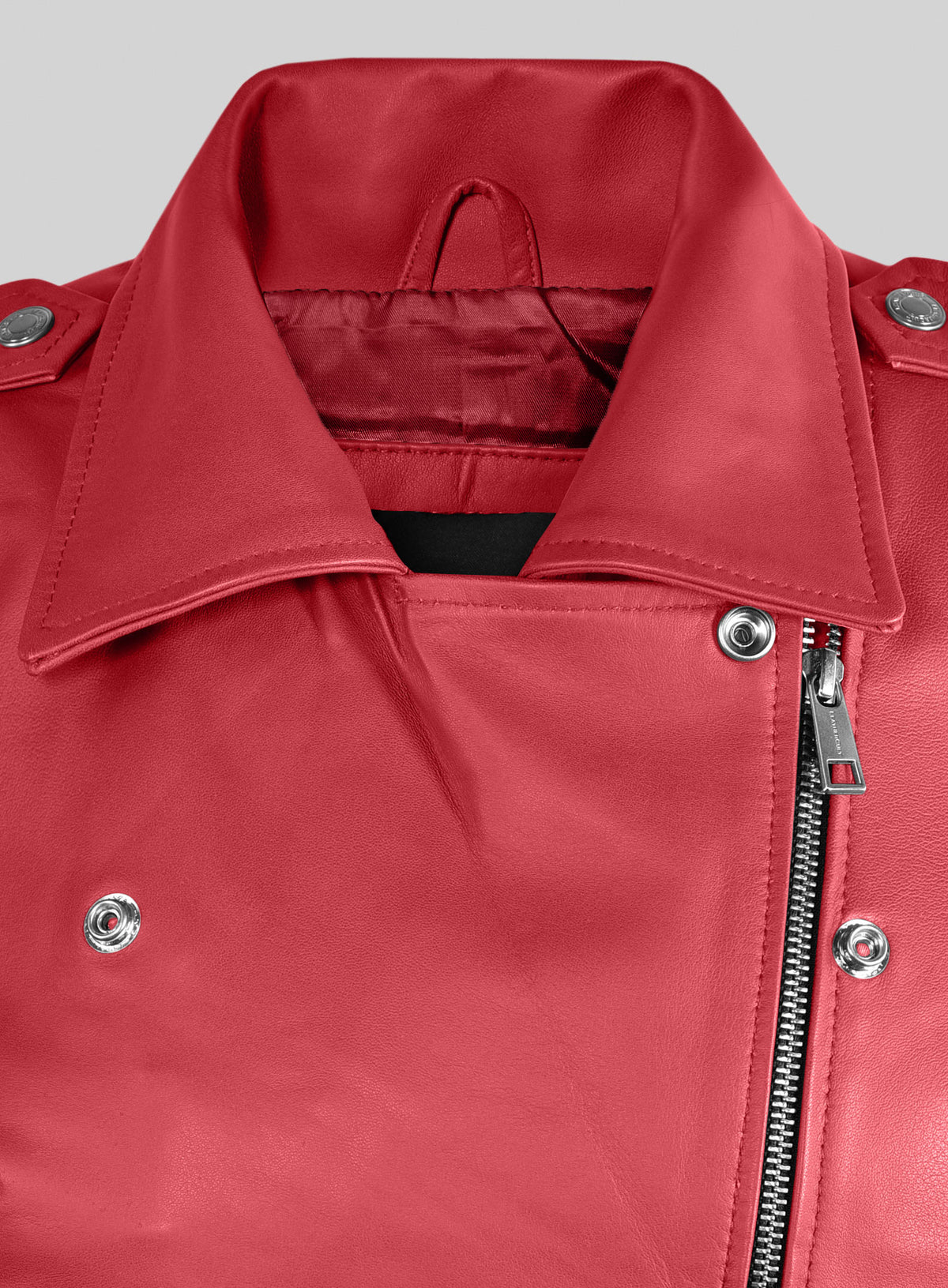 Close-up of red leather biker jacket collar, lapel snaps and asymmetric zip