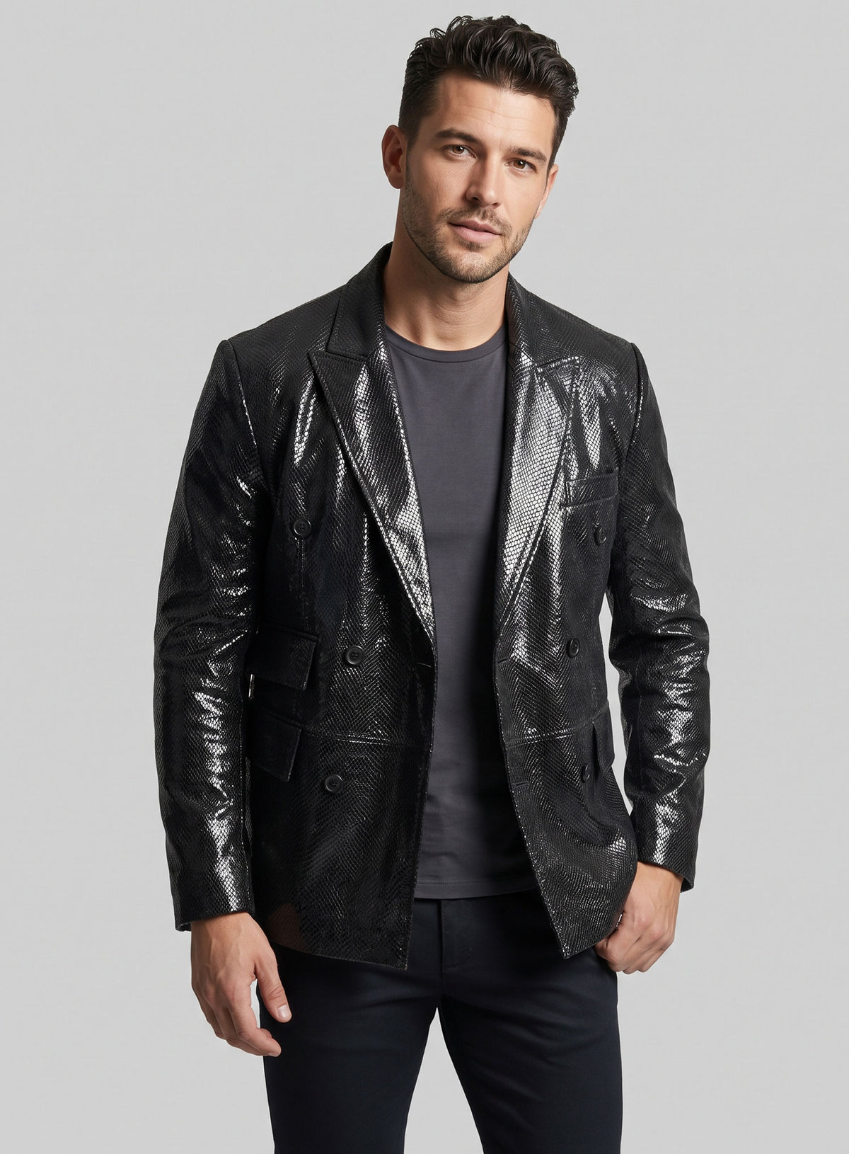 Man wearing a black double-breasted snake embossed leather blazer with peak lapel