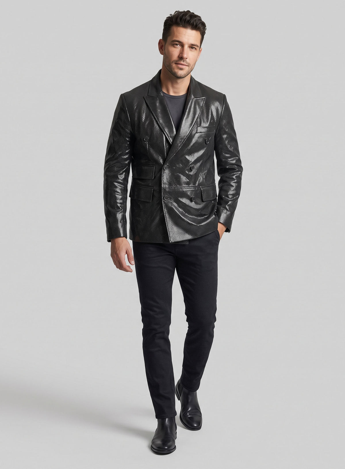Full-length view of a man in a black double-breasted snake embossed leather blazer