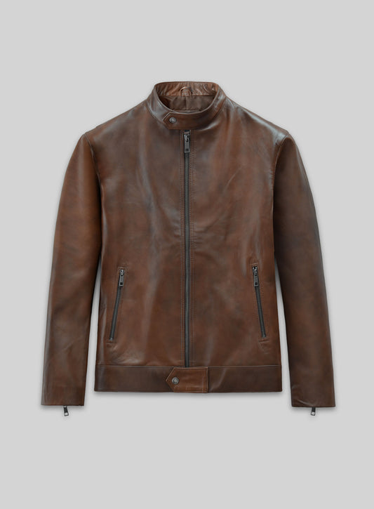 Front view of a Spanish brown leather biker-style jacket with zip pockets and waist tab