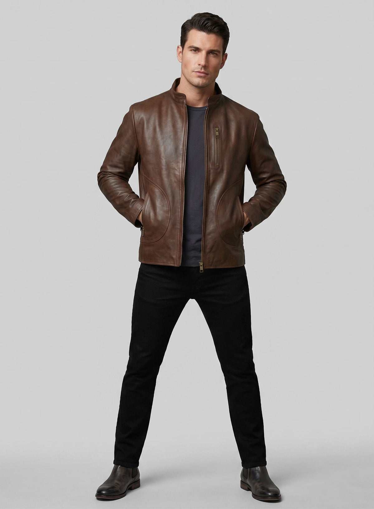 Full-length view of a man wearing a brown leather jacket with stand collar and zip pockets