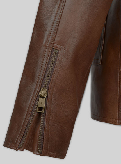 Close-up of brass zipper on the sleeve cuff of a brown leather jacket