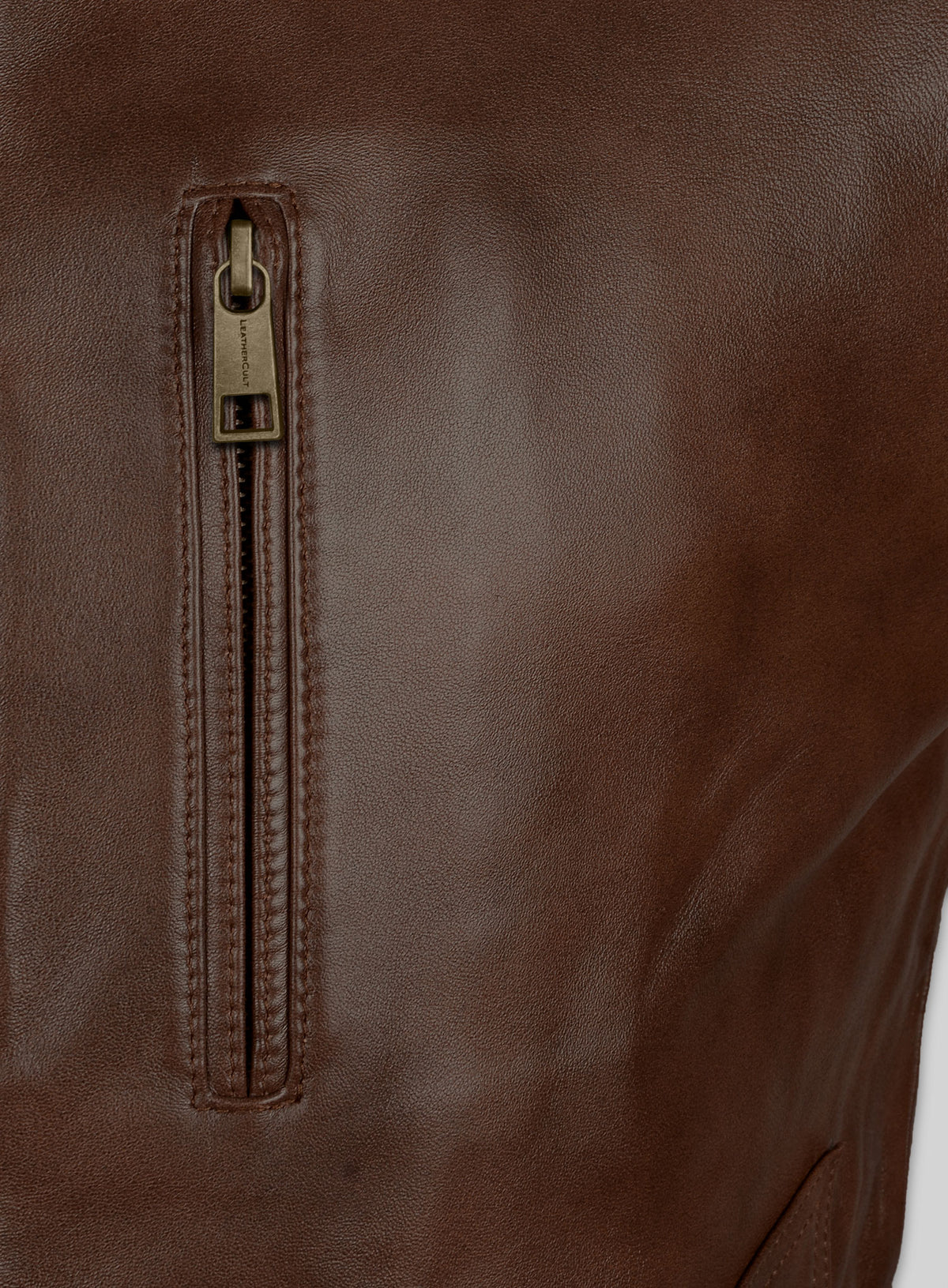 Close-up of chest zip pocket on a brown leather jacket