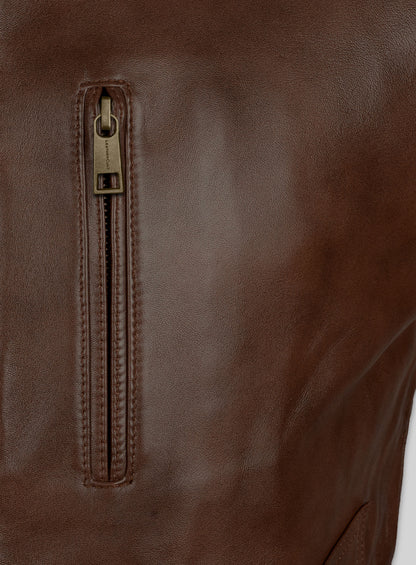 Close-up of chest zip pocket on a brown leather jacket