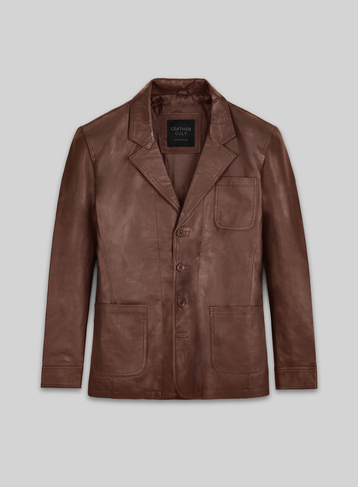 Front view of a tan brown leather blazer with notch lapel, three buttons and patch pockets
