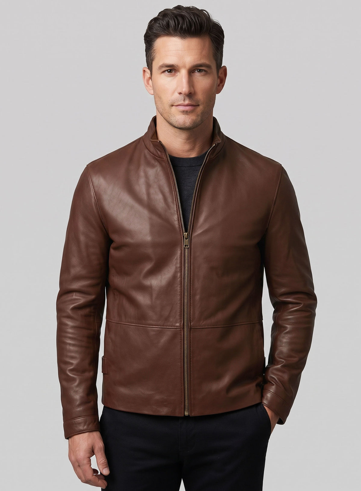 Man wearing a brown leather jacket with stand collar and front zip