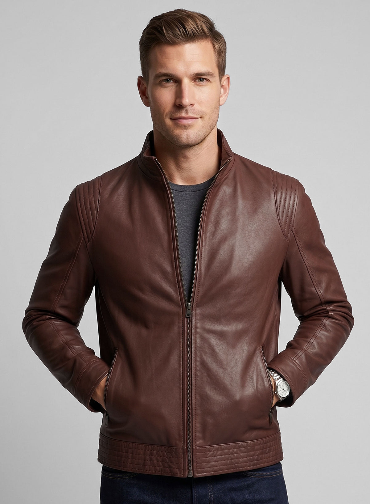 Man wearing a tan brown washed wax leather jacket with hands in pockets