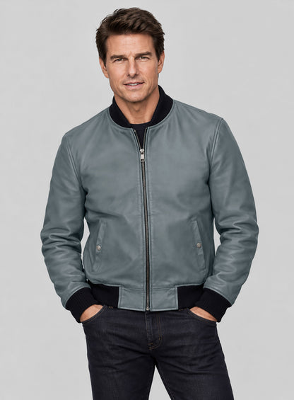 Man wearing a grey leather bomber jacket with zip front and black ribbed trim
