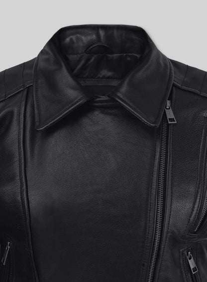 Close-up of the collar and asymmetric front zip of a black leather biker jacket