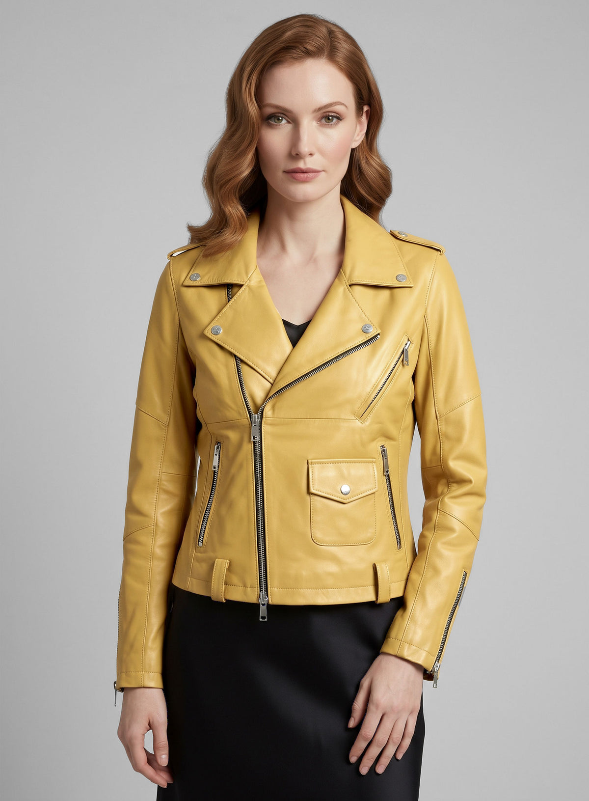Woman wearing a yellow leather biker jacket with asymmetric zip and flap pocket, front view